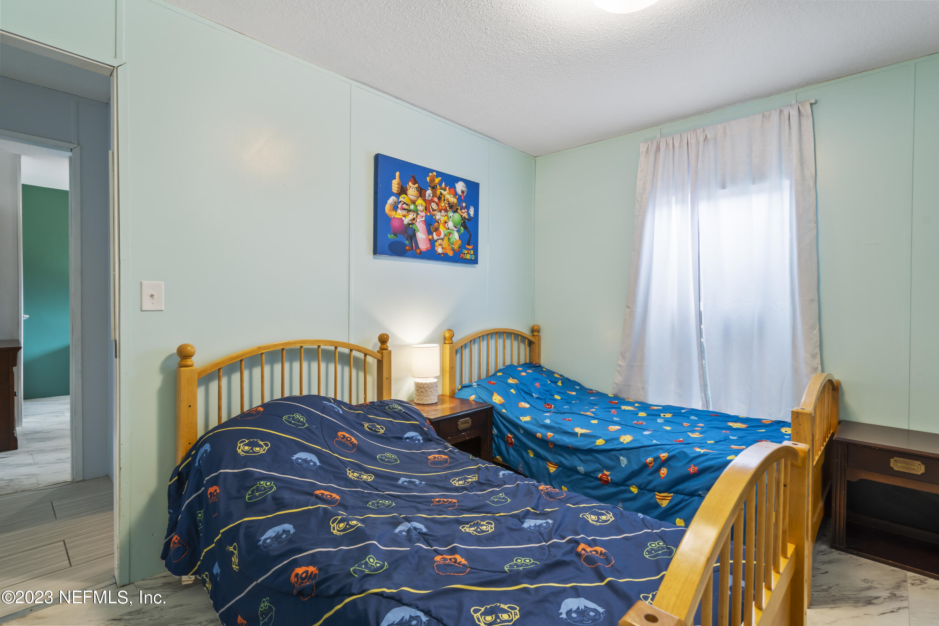 198 Yellow Water Road Baldwin, FL 32234 - Photo 20 of 37 a bedroom with a bed table and a window