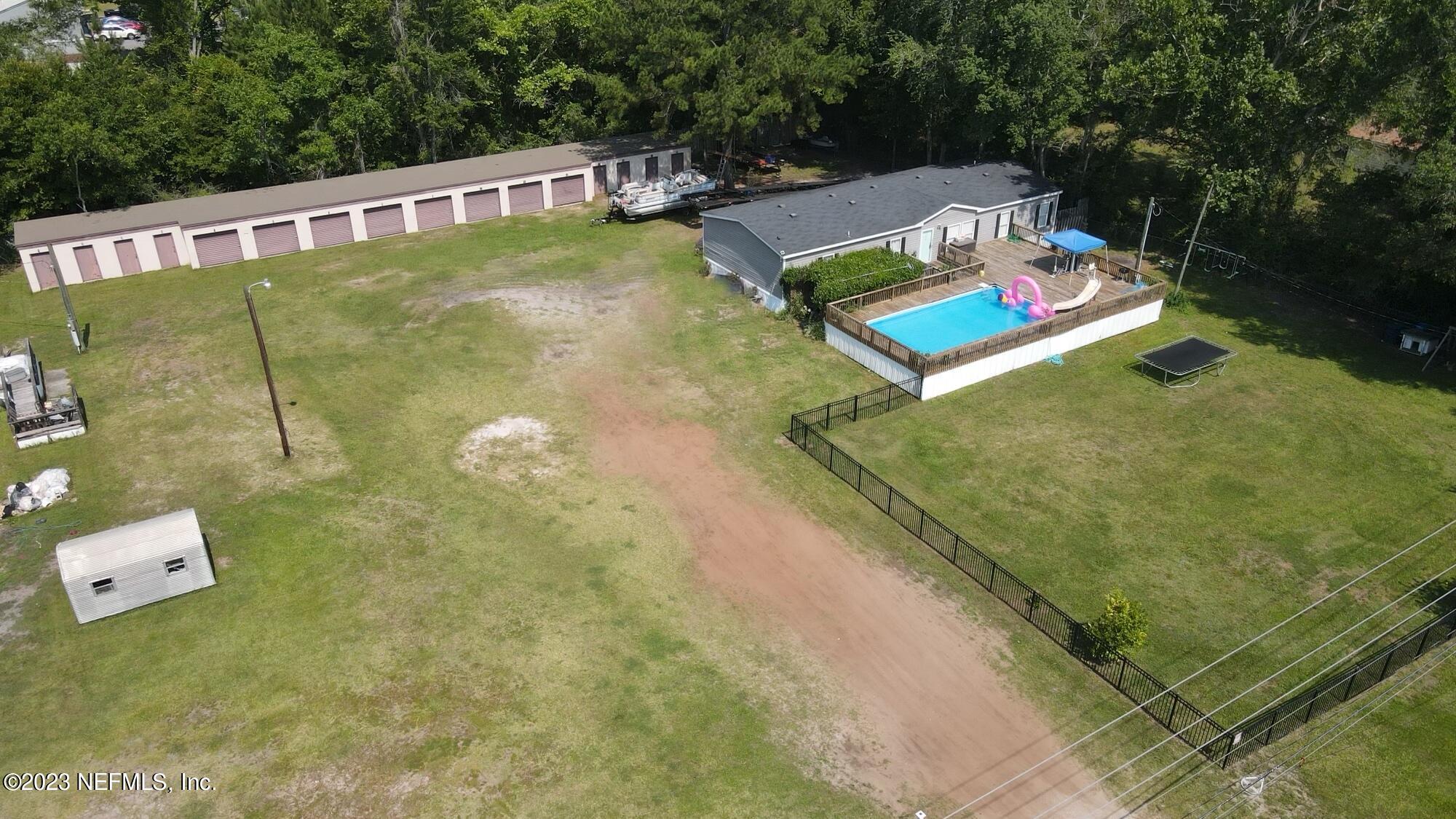 198 Yellow Water Road Baldwin, FL 32234 - Photo 2 of 37 a view of a pool with chairs
