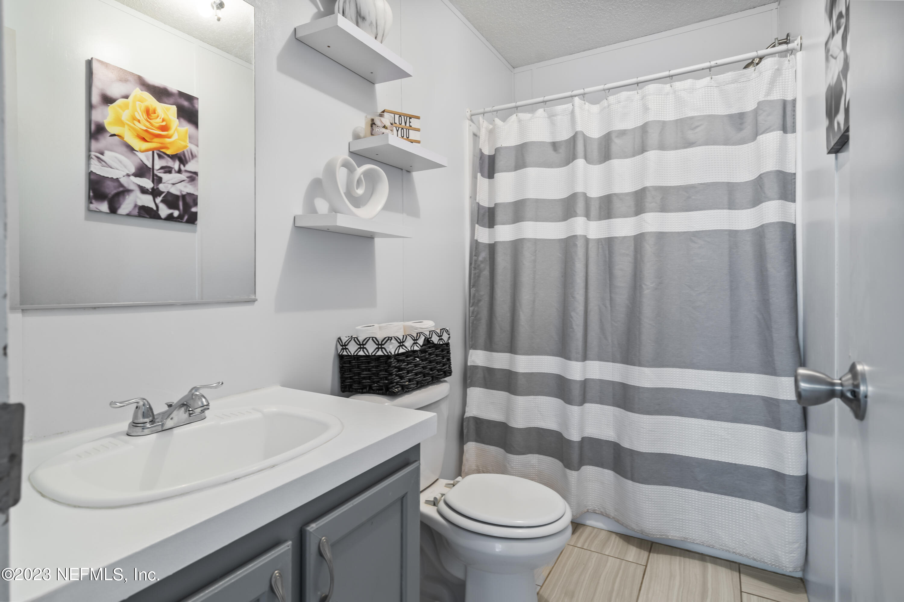 198 Yellow Water Road Baldwin, FL 32234 - Photo 21 of 37 a bathroom with a sink toilet and shower