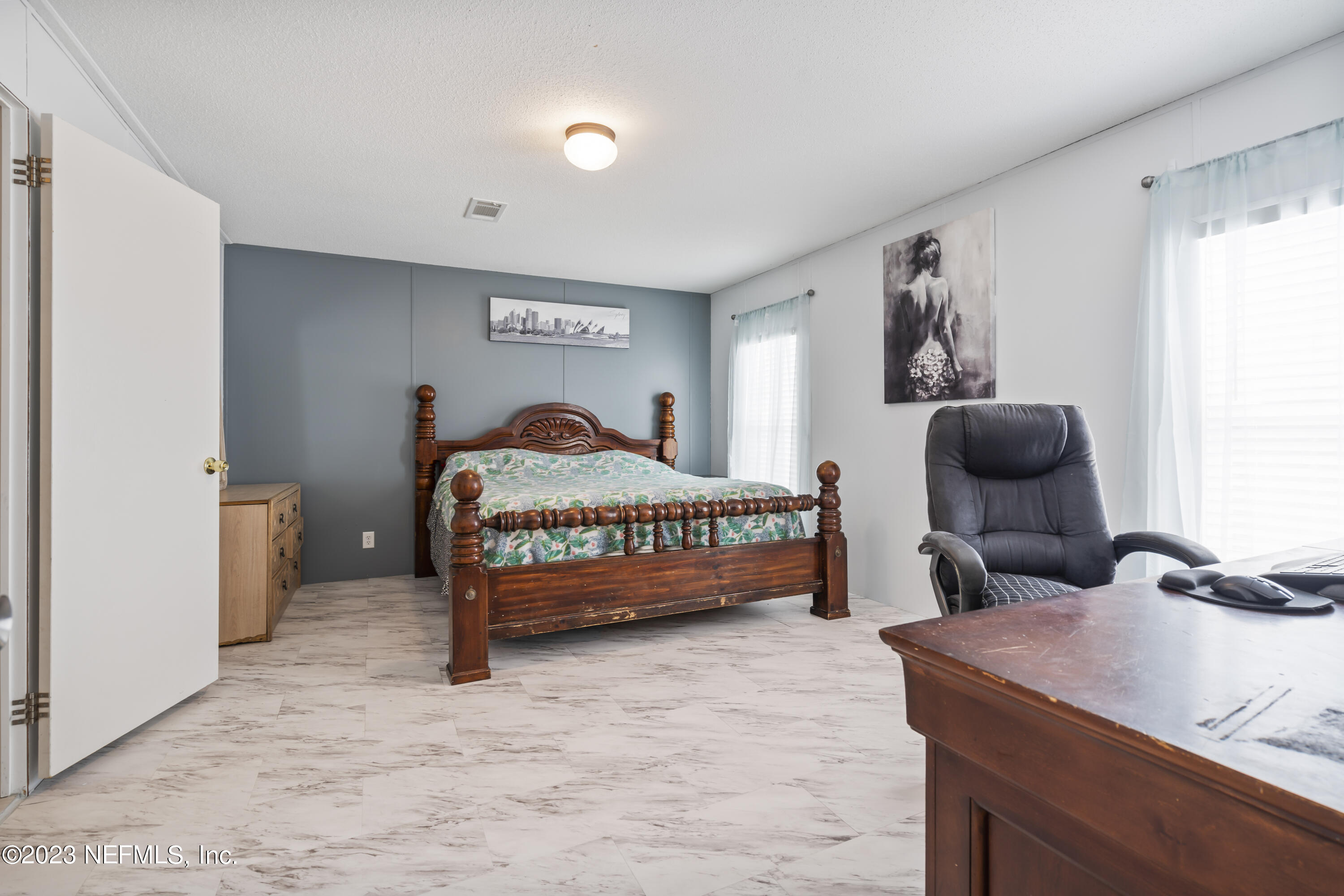 198 Yellow Water Road Baldwin, FL 32234 - Photo 22 of 37 a bedroom with a bed and window