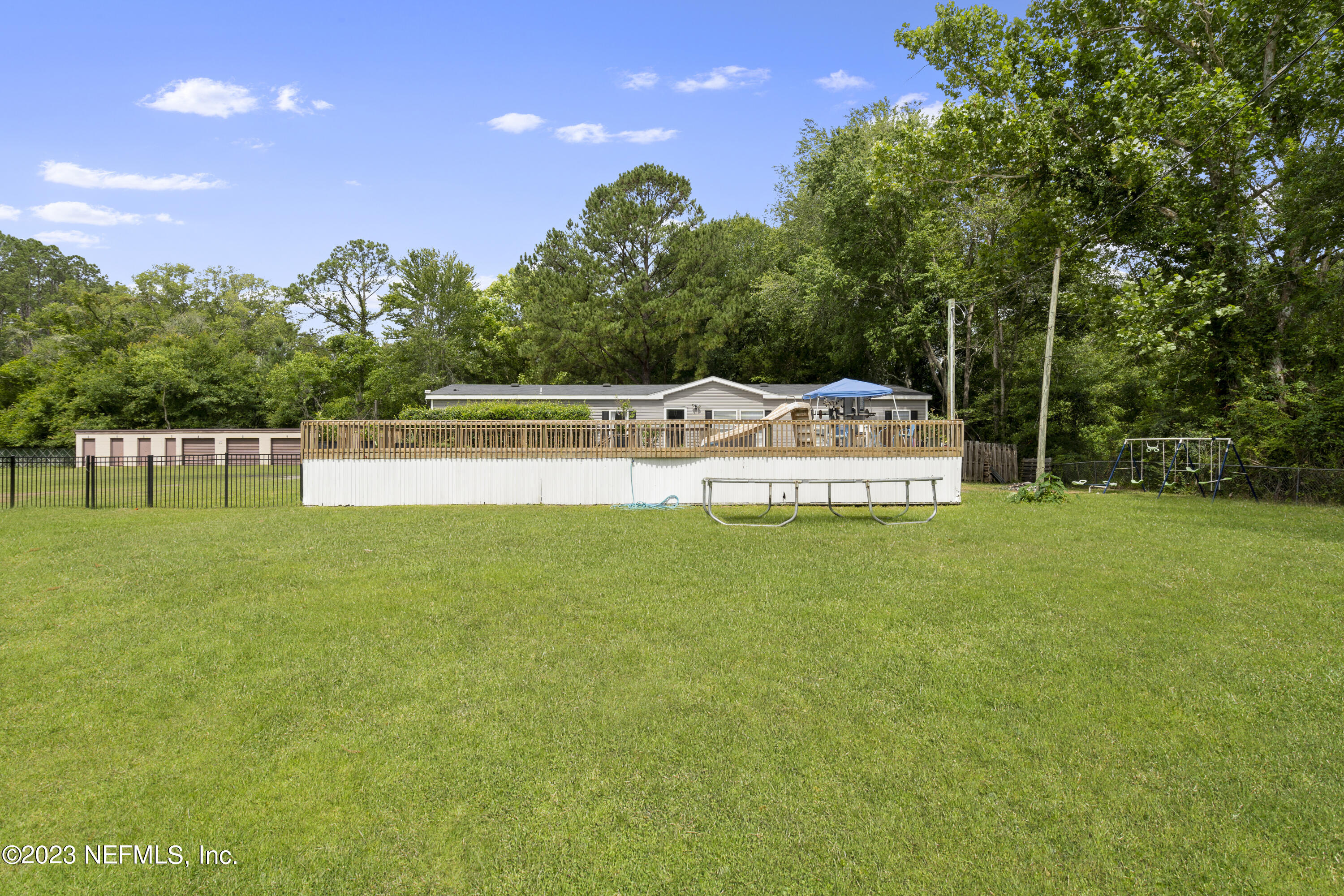 198 Yellow Water Road Baldwin, FL 32234 - Photo 3 of 37 a view of a house with a backyard and a yard