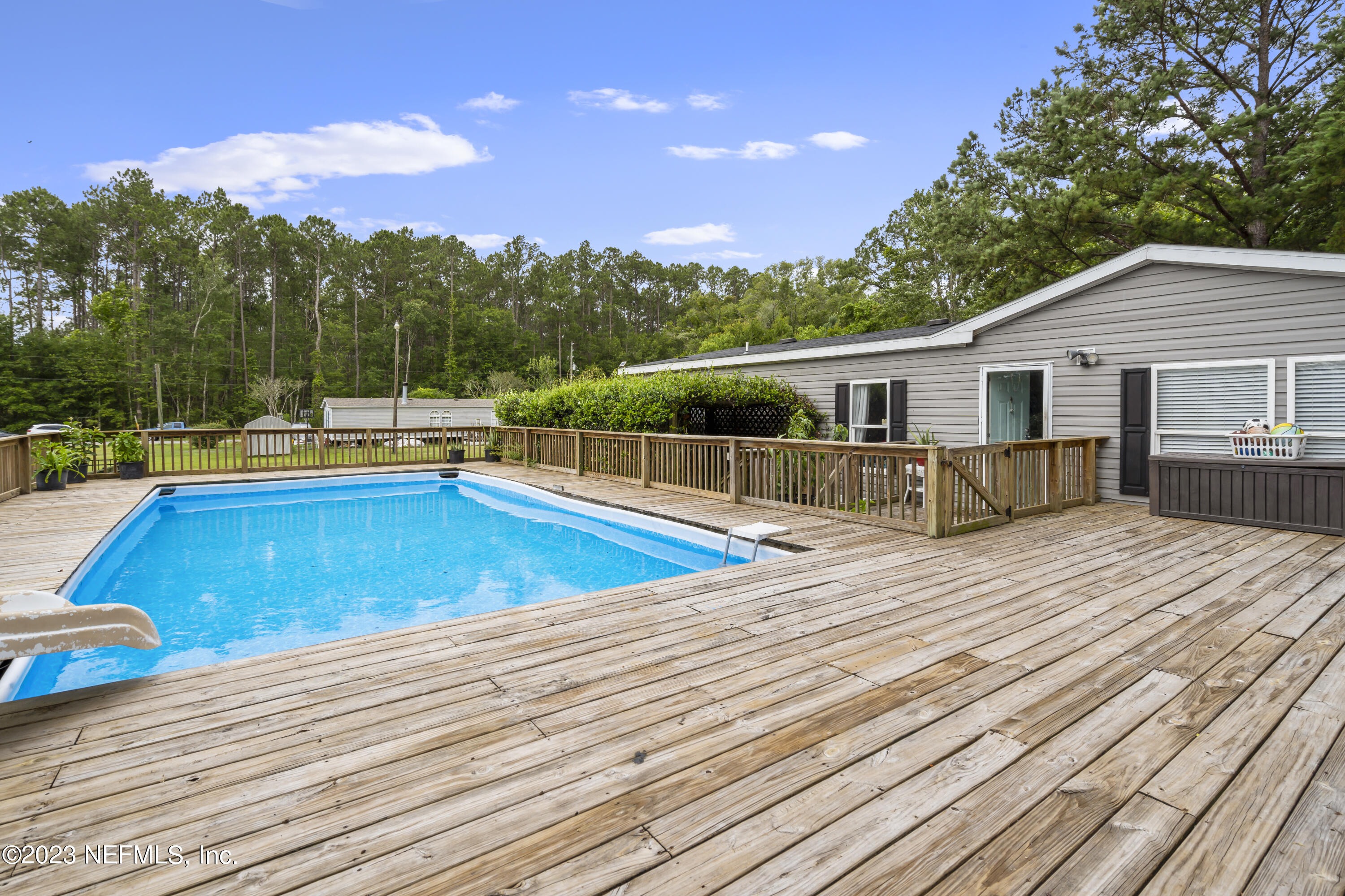 198 Yellow Water Road Baldwin, FL 32234 - Photo 34 of 37 a view of a house with pool and sitting area