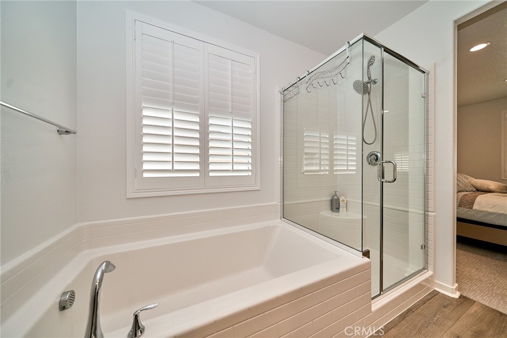 7902 Ravello Court Highland, CA 92346 - Photo 23 of 52 a bathroom with a tub and a shower