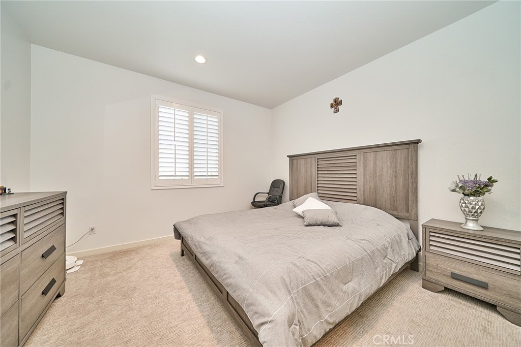 7902 Ravello Court Highland, CA 92346 - Photo 25 of 52 a bedroom with a bed and a window