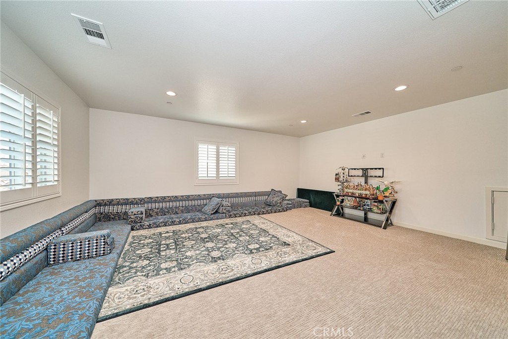 7902 Ravello Court Highland, CA 92346 - Photo 26 of 52 a living room with furniture and a window