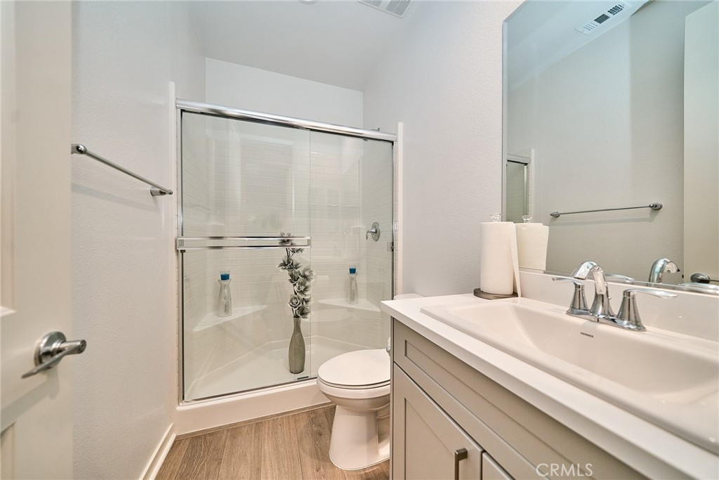 7902 Ravello Court Highland, CA 92346 - Photo 36 of 52 a bathroom with a sink a toilet and shower