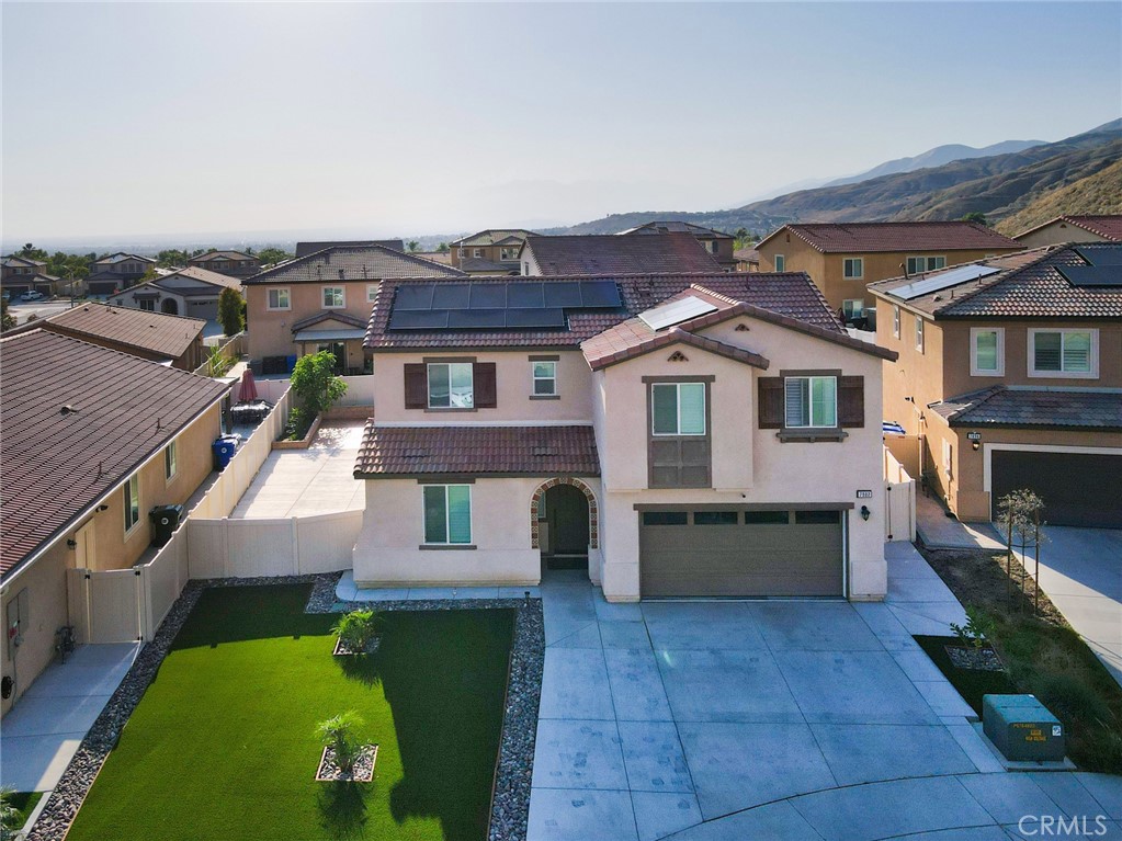 7902 Ravello Court Highland, CA 92346 - Photo 4 of 52 a front view of a house with garden