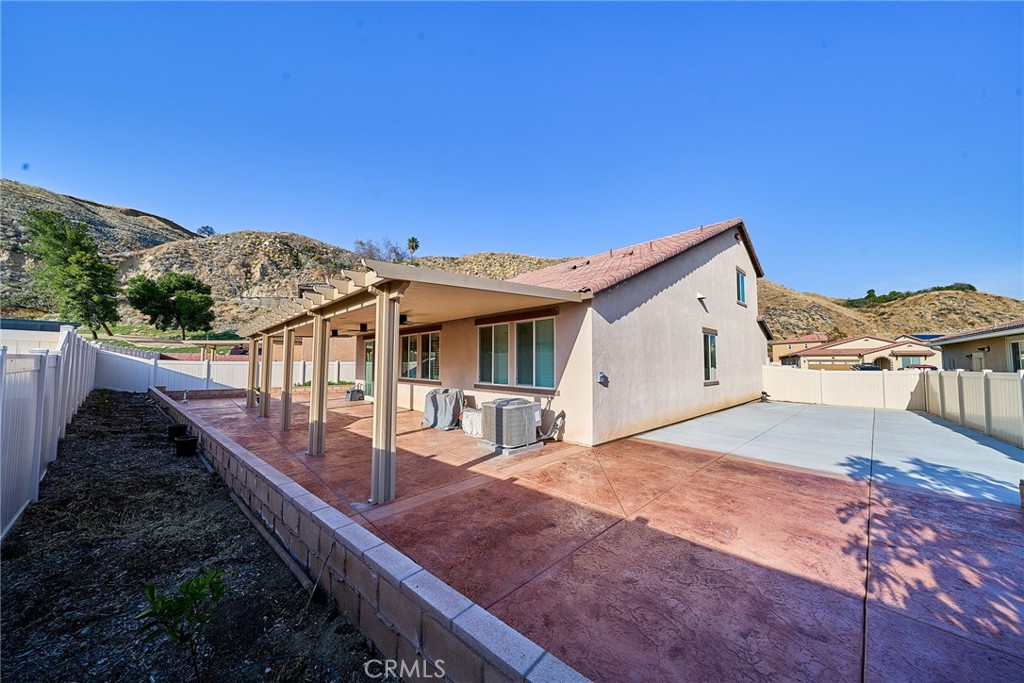7902 Ravello Court Highland, CA 92346 - Photo 43 of 52 a view of a house with a backyard