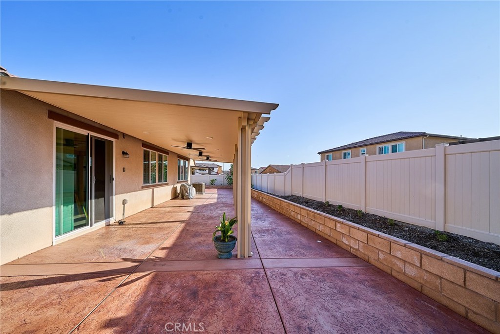 7902 Ravello Court Highland, CA 92346 - Photo 45 of 52 a view of a house with a backyard