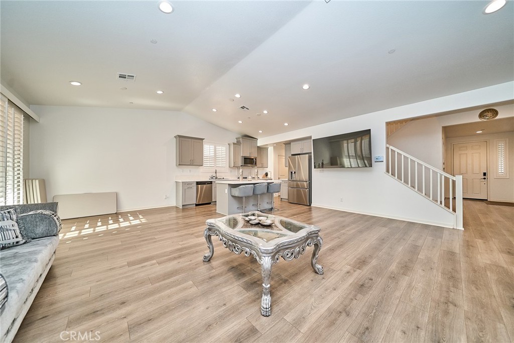 7902 Ravello Court Highland, CA 92346 - Photo 7 of 52 a living room with furniture and a wooden floor