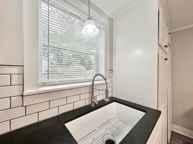 a view of hallway with wooden floor