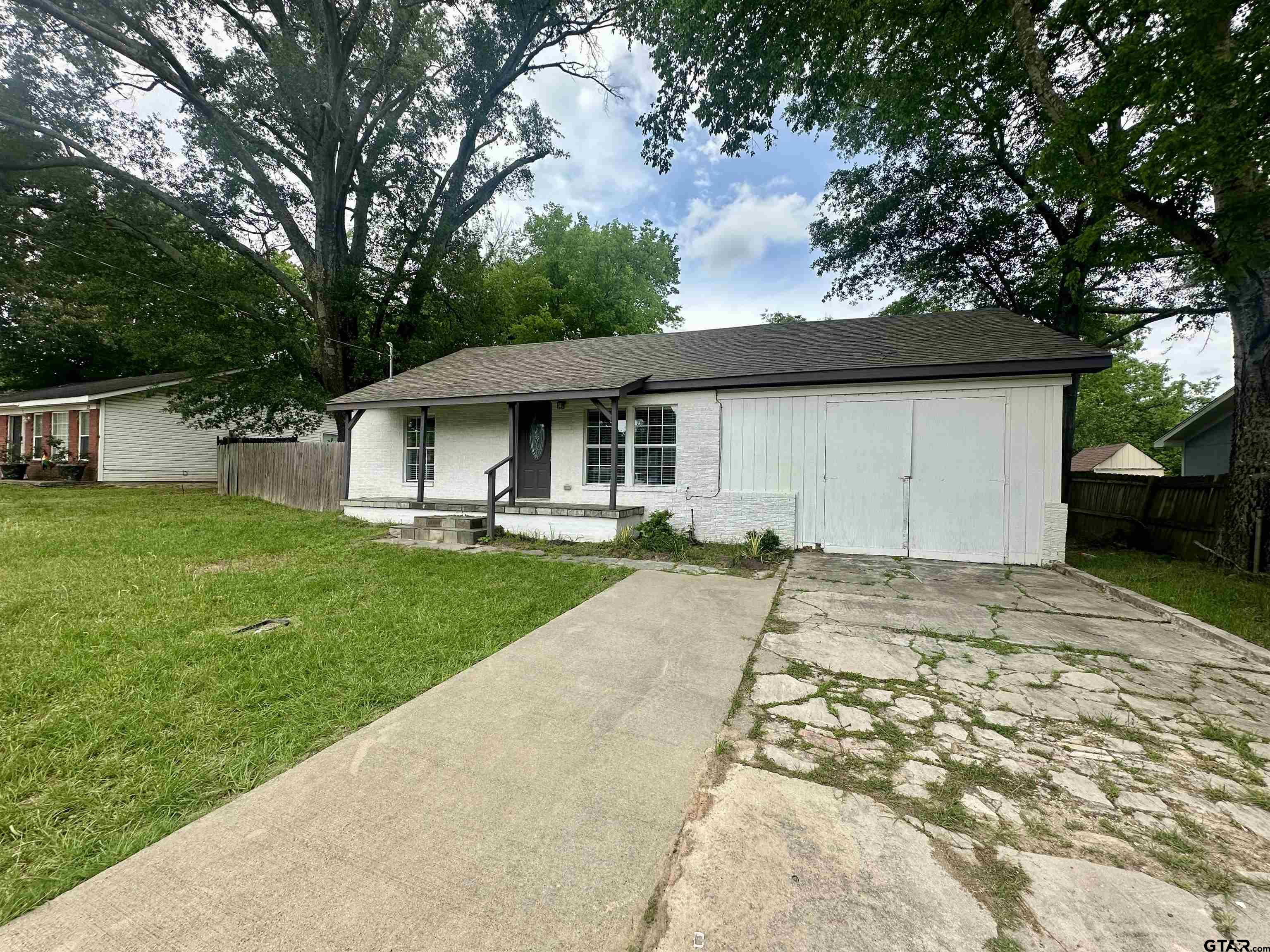 219 Half Street Lindale, TX 75771 - Photo 2 of 33 a view of a house with a yard