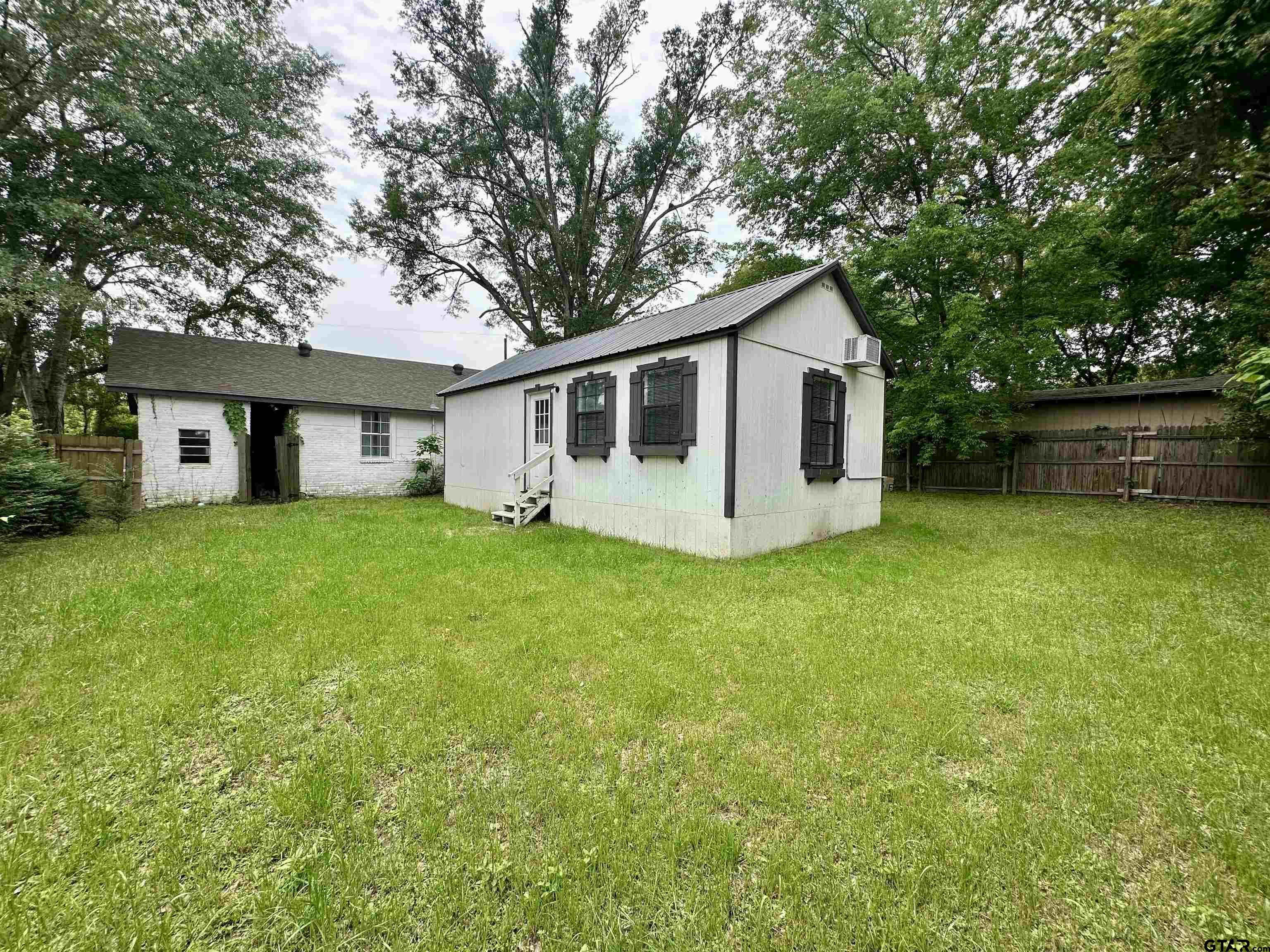 219 Half Street Lindale, TX 75771 - Photo 28 of 33 a front view of house with yard and green space