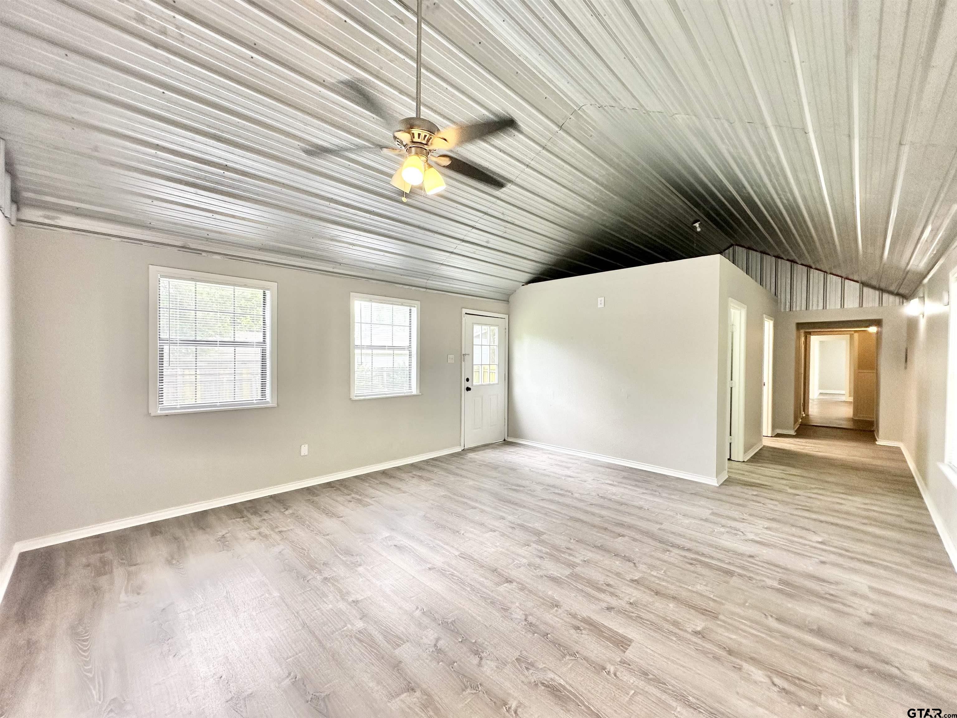 219 Half Street Lindale, TX 75771 - Photo 33 of 33 wooden floor in an empty room with a window