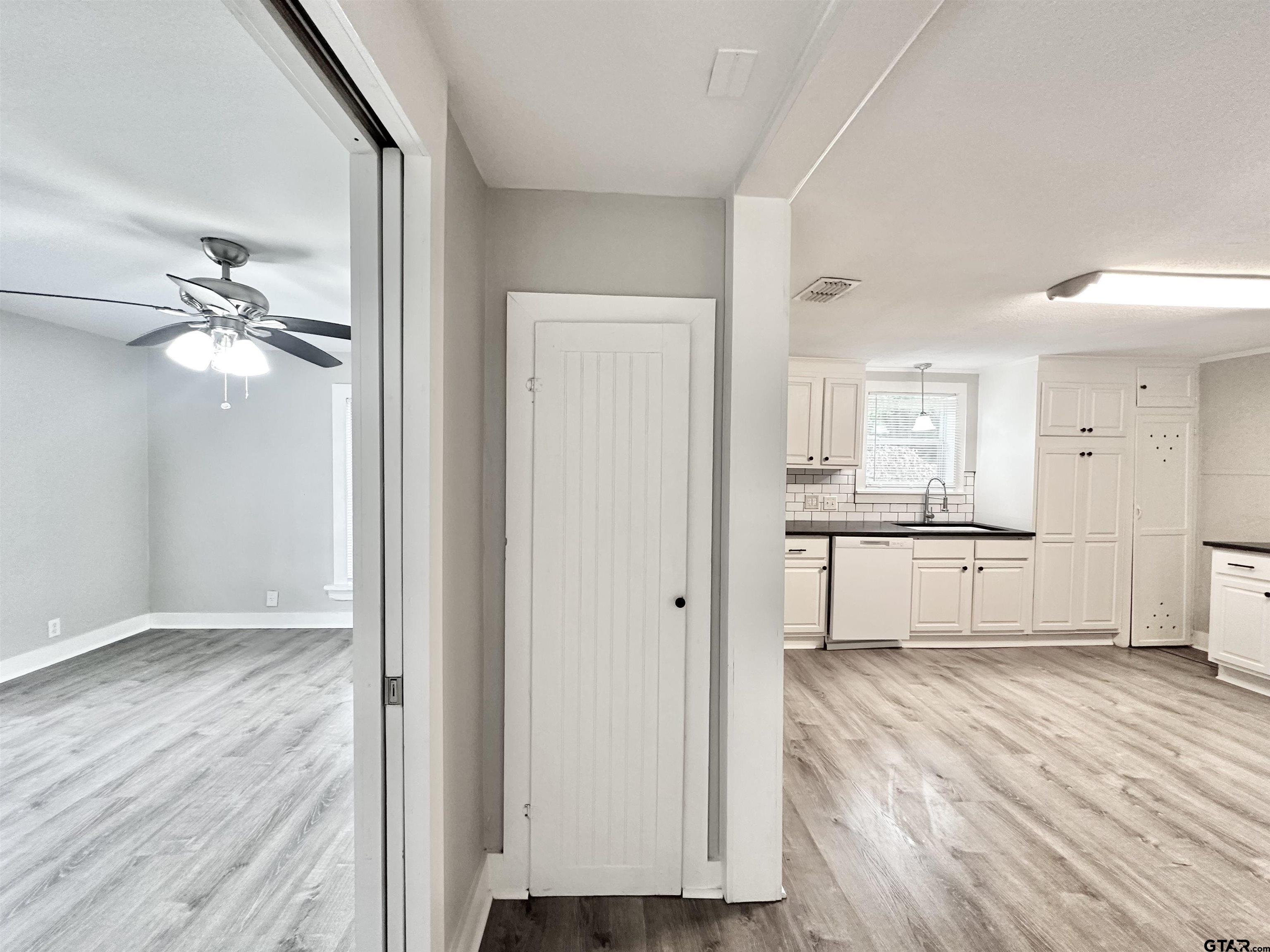 219 Half Street Lindale, TX 75771 - Photo 6 of 33 a view of a kitchen with wooden floor