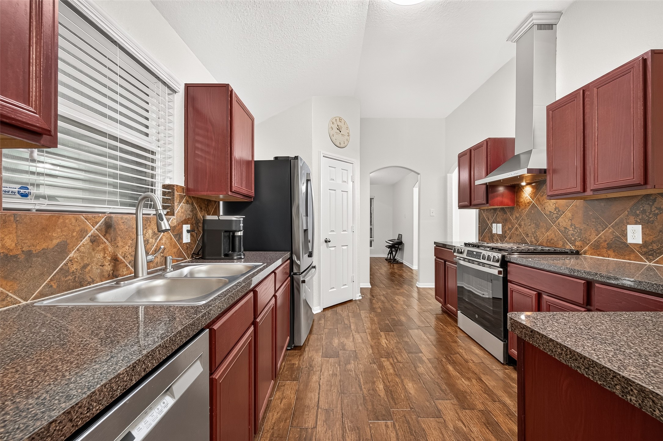 3155 View Valley Trail Katy, TX 77493 - Photo 26 of 50 Panoramic kitchen view showcasing the perfect blend of warmth, functionality, and modern style