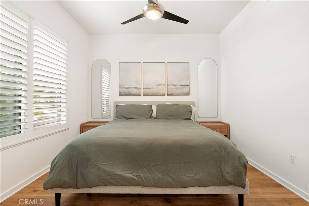 21 Gramercy, Unit 102 Irvine, CA 92612 - Photo 11 of 30 Comfortable secondary bedroom with modern ceiling fan and plenty of natural light.
