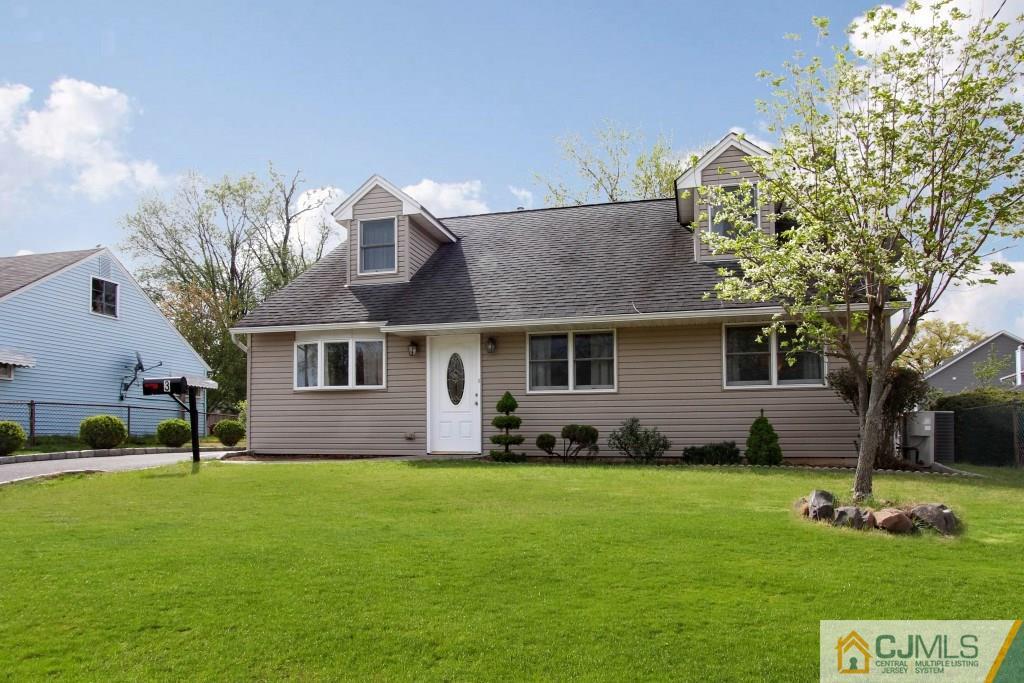 3 Markham Road Edison, NJ 08817 - Photo 1 of 23 a front view of a house with a yard and trees