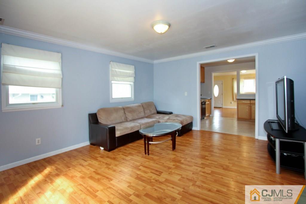 3 Markham Road Edison, NJ 08817 - Photo 11 of 23 a living room with furniture and a flat screen tv