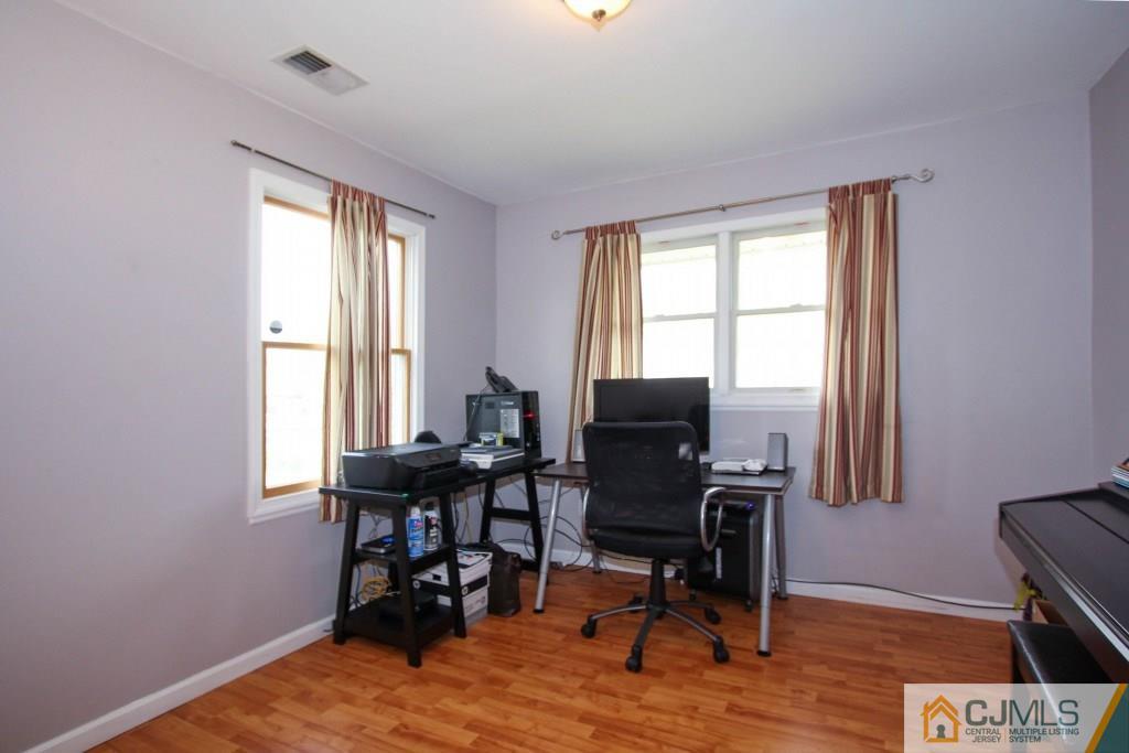 3 Markham Road Edison, NJ 08817 - Photo 12 of 23 a view of a workspace with furniture and a window