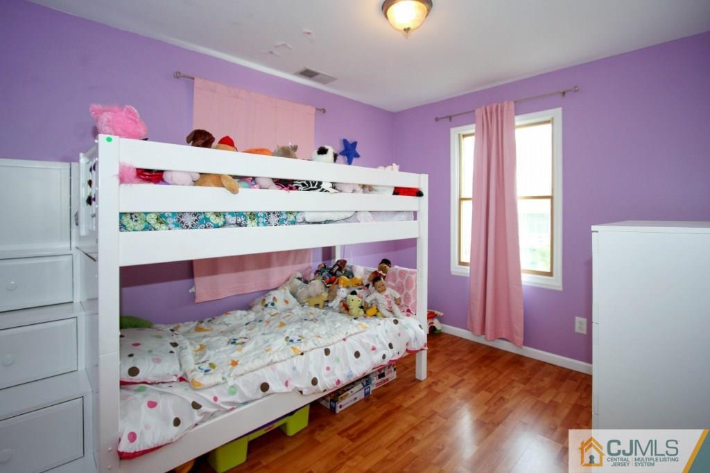 3 Markham Road Edison, NJ 08817 - Photo 13 of 23 a bed room with a bed and a dresser
