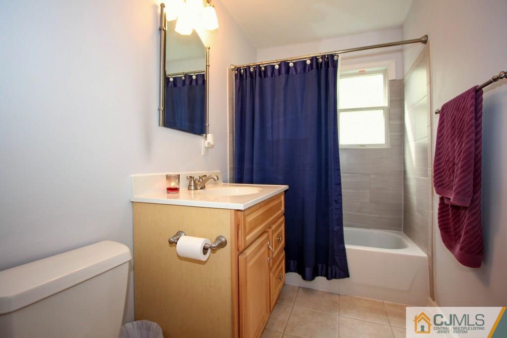 3 Markham Road Edison, NJ 08817 - Photo 14 of 23 a bathroom with a granite countertop sink toilet and shower