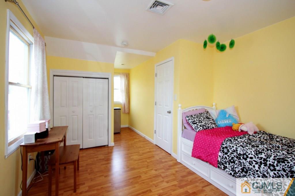 3 Markham Road Edison, NJ 08817 - Photo 19 of 23 a bedroom with a bed and wooden floor