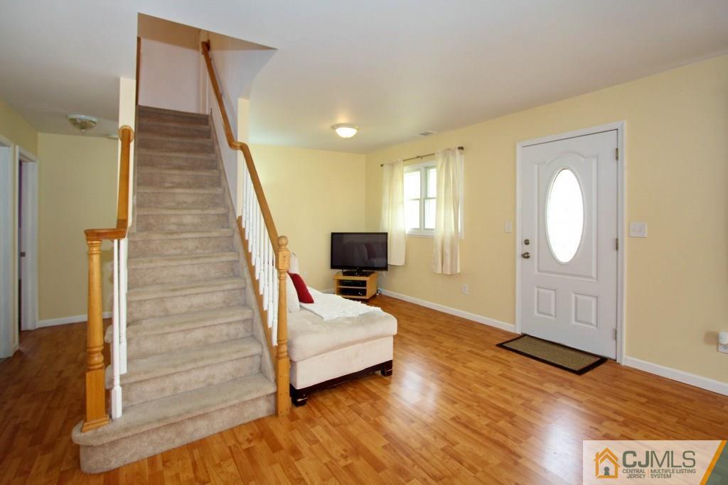 3 Markham Road Edison, NJ 08817 - Photo 3 of 23 a living room with furniture and a wooden floor