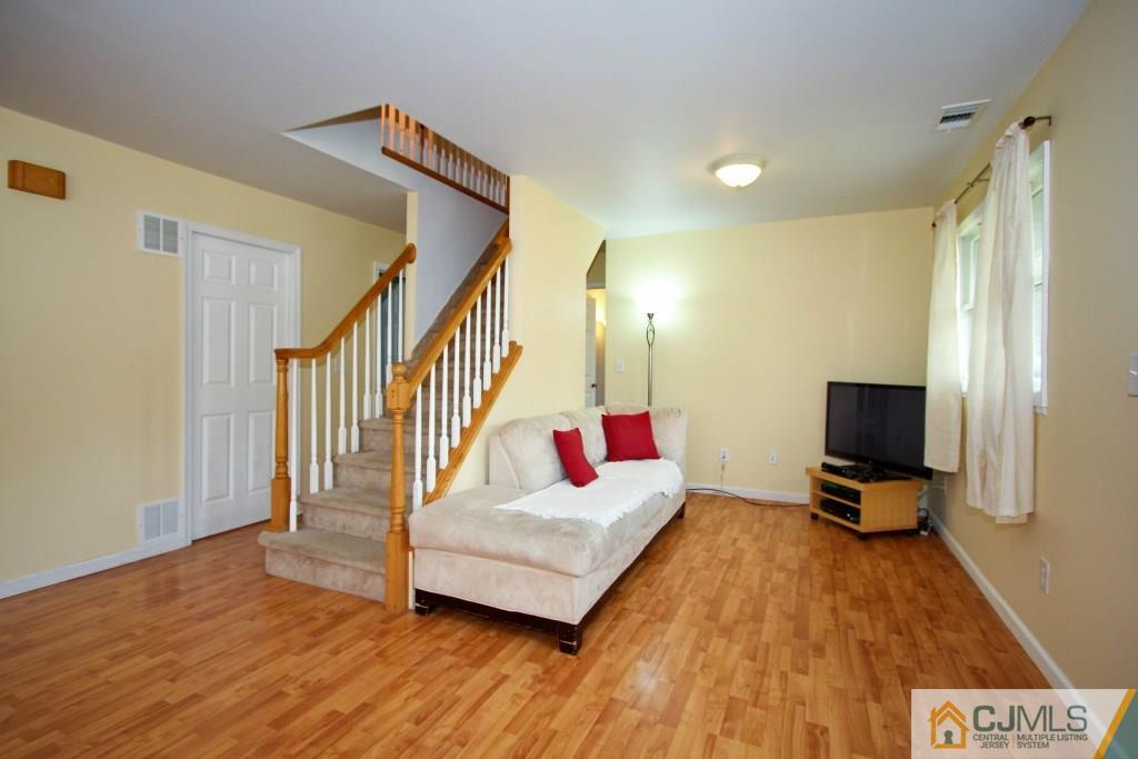 3 Markham Road Edison, NJ 08817 - Photo 4 of 23 a living room with furniture and a flat screen tv