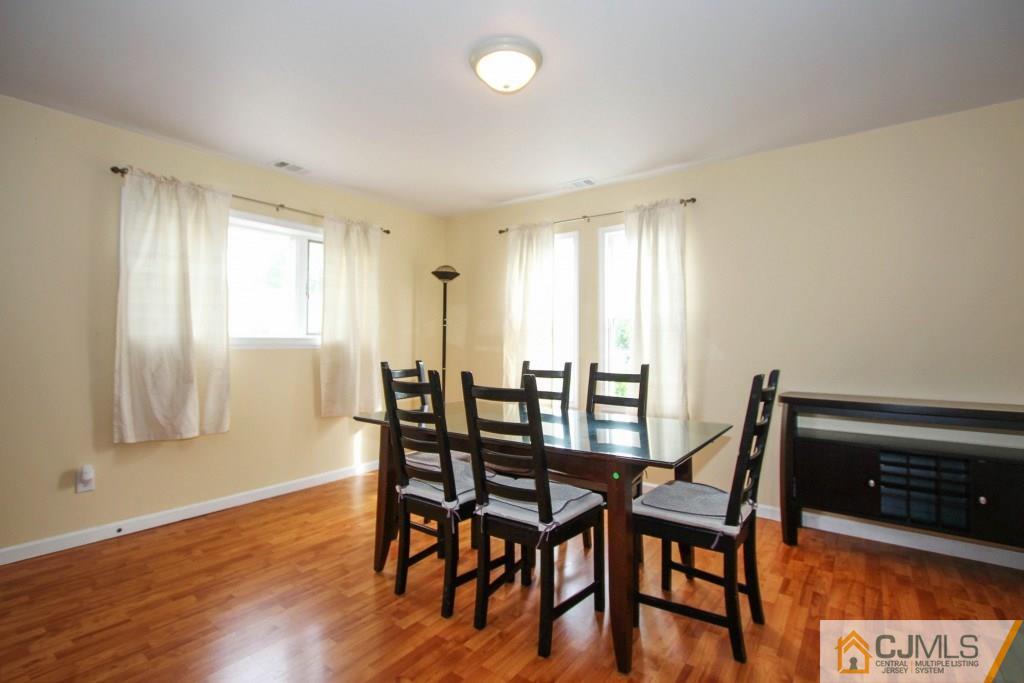 3 Markham Road Edison, NJ 08817 - Photo 6 of 23 a view of a dining room with furniture and wooden floor