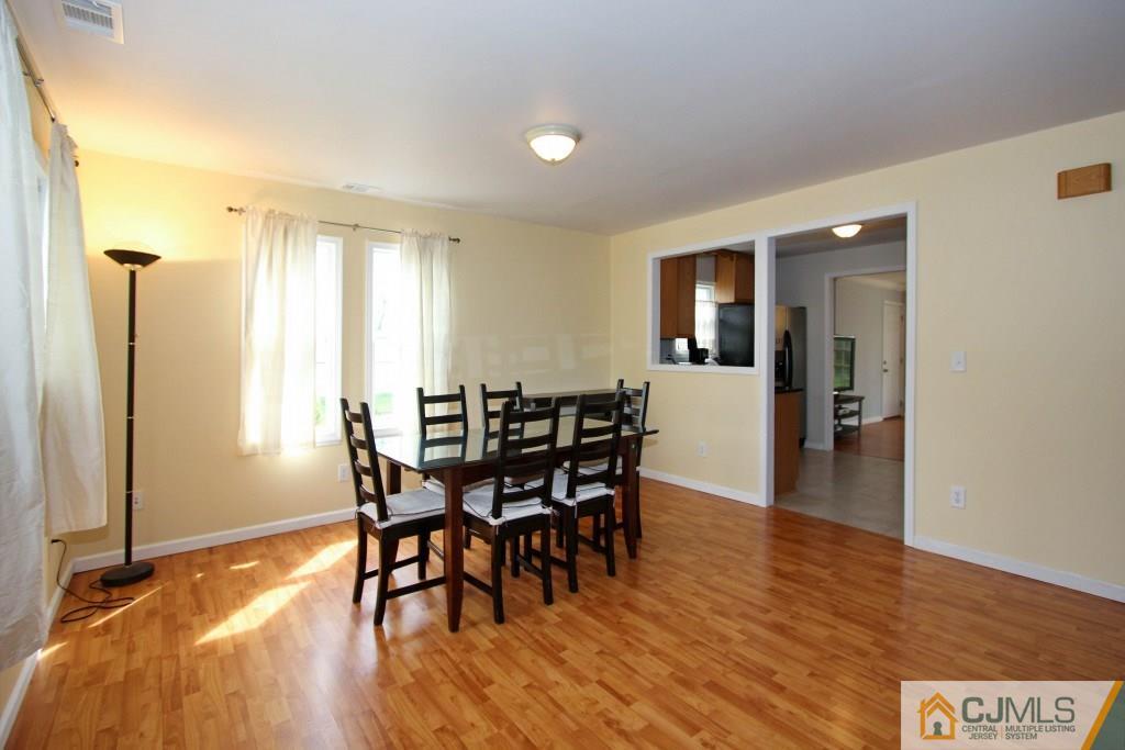 3 Markham Road Edison, NJ 08817 - Photo 7 of 23 a view of a dining room with furniture and wooden floor