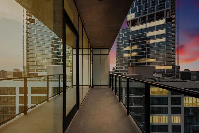 a kitchen with stainless steel appliances granite countertop a sink a stove a refrigerator and cabinets