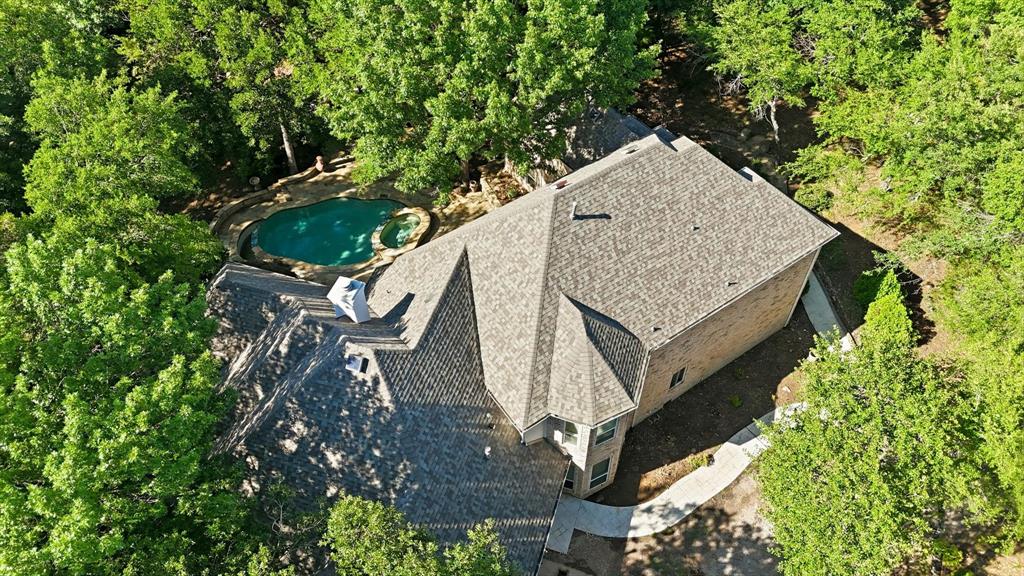 970 Crystal Cove Oak Point, TX 75068 - Photo 38 of 40 an aerial view of a house with a yard and large trees