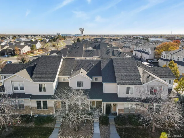 aerial view of a house with a yard