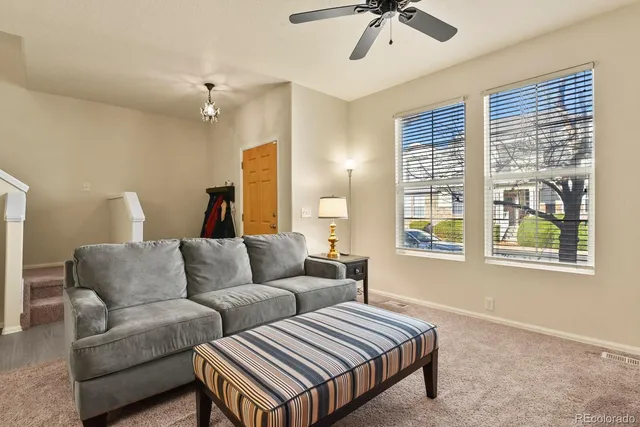 a living room with furniture and a window
