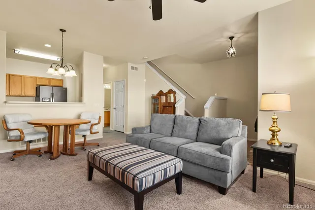 a living room with furniture and a table