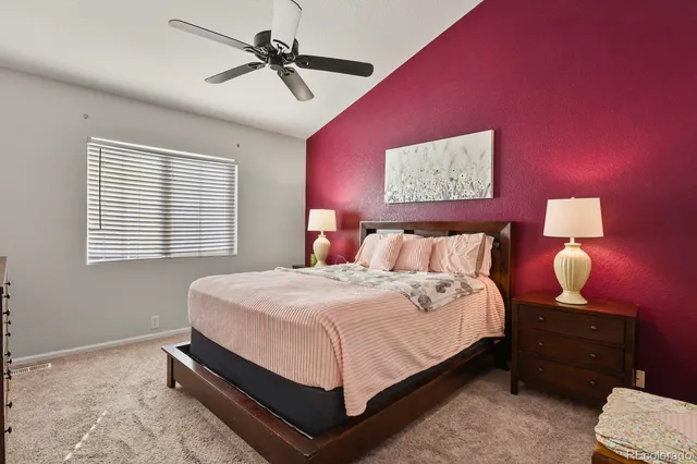 a bed room with a bed and a window