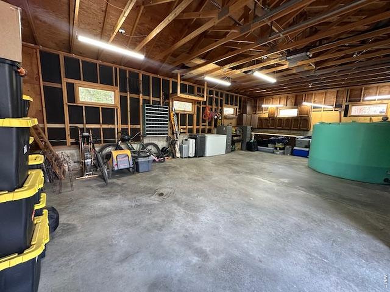 5 Mohawk Road Lyons, CO 80540 - Photo 32 of 49 Workbench, shelving and tons of space in the oversized 864 sft garage.