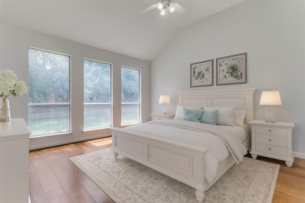 3109 Emory Drive Flower Mound, TX 75022 - Photo 5 of 15 a spacious bedroom with a large bed and a large window