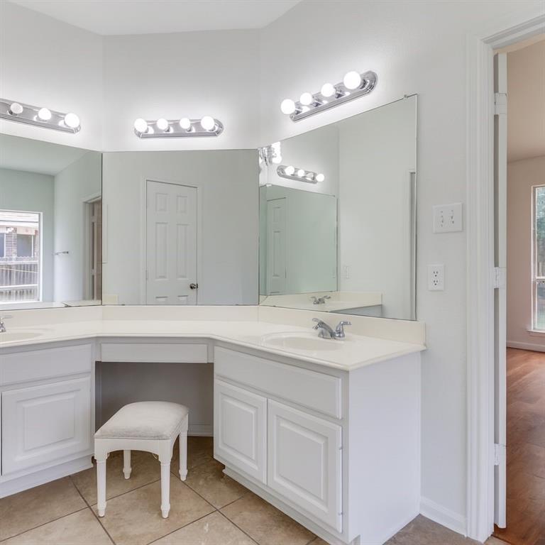 3109 Emory Drive Flower Mound, TX 75022 - Photo 7 of 15 a spacious bathroom with a sink and a mirror