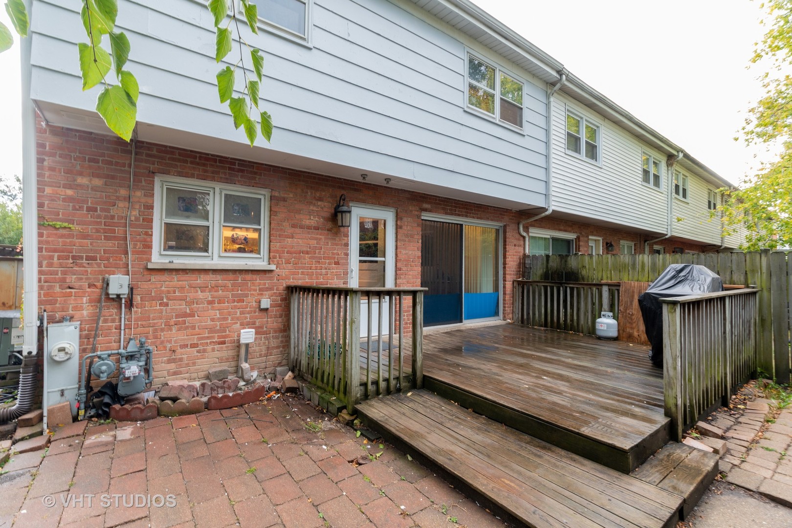 8826 Dee Road Des Plaines, IL 60016 - Photo 2 of 16 a view of a wooden deck with a bench
