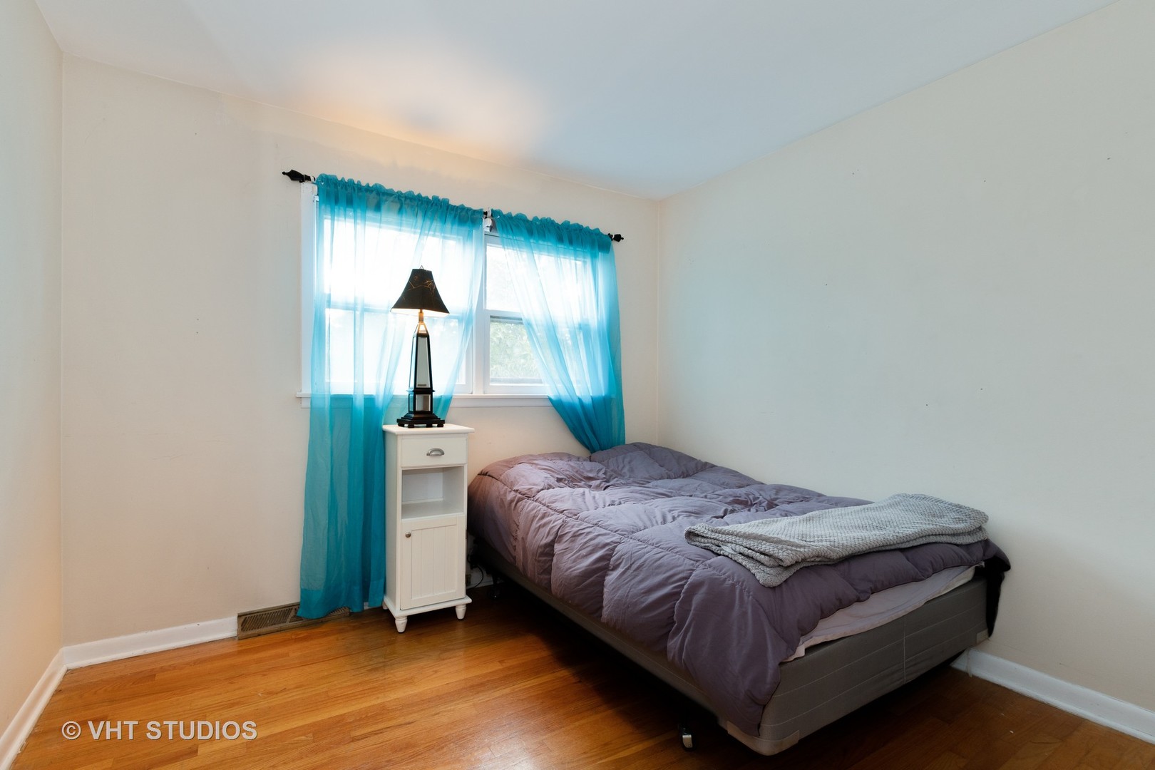 8826 Dee Road Des Plaines, IL 60016 - Photo 11 of 16 a bedroom with a bed and a dresser