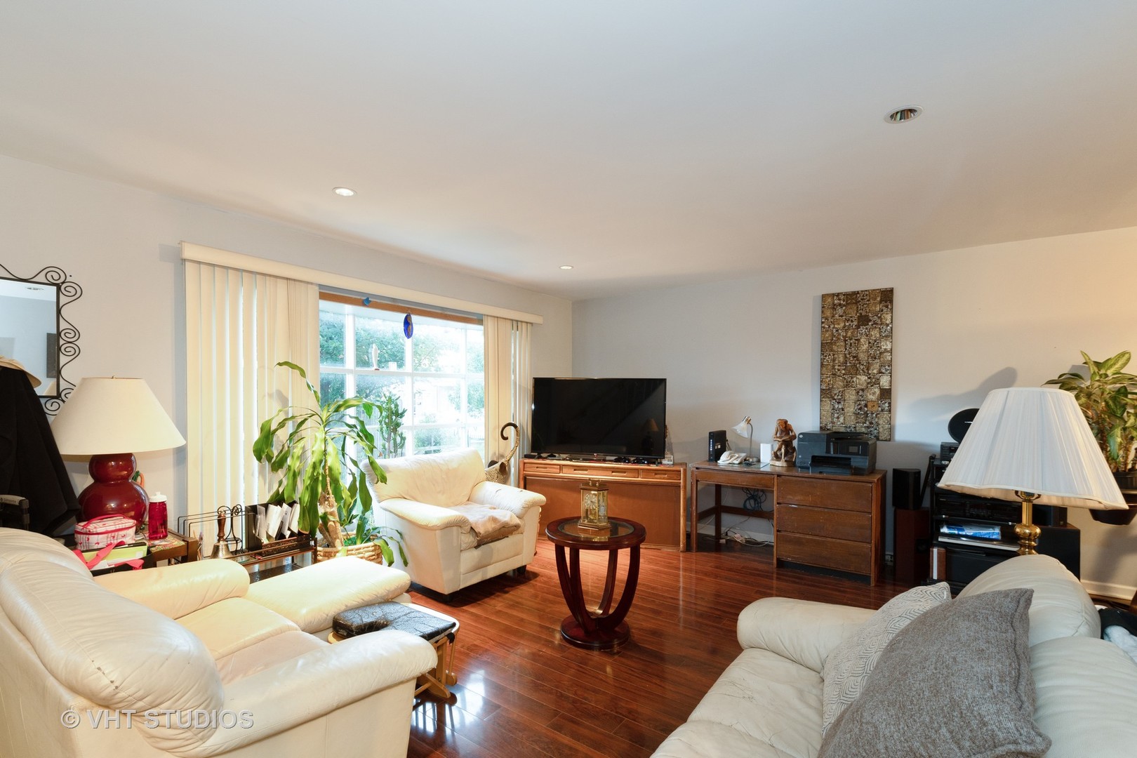8826 Dee Road Des Plaines, IL 60016 - Photo 5 of 16 a living room with furniture and a flat screen tv