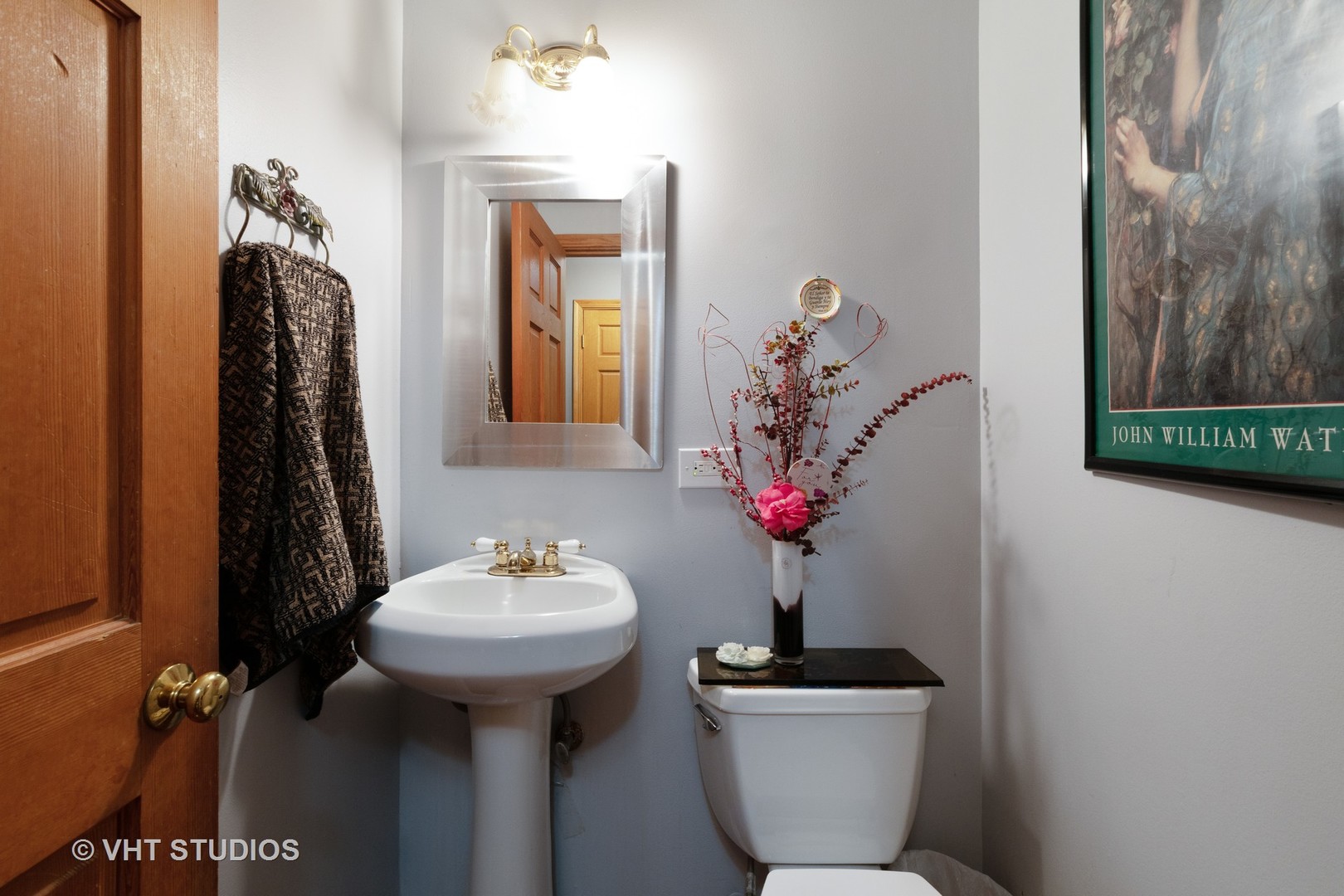 8826 Dee Road Des Plaines, IL 60016 - Photo 6 of 16 a bathroom with a toilet sink and mirror