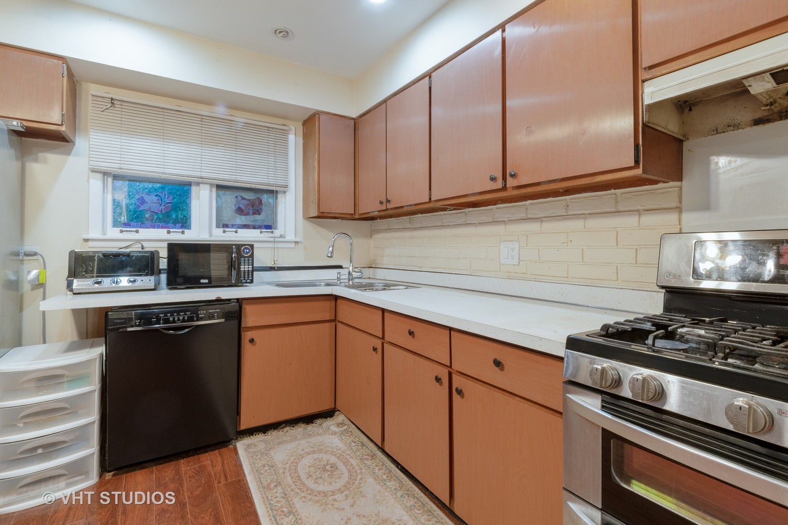 8826 Dee Road Des Plaines, IL 60016 - Photo 7 of 16 a kitchen with stainless steel appliances granite countertop a stove and a sink