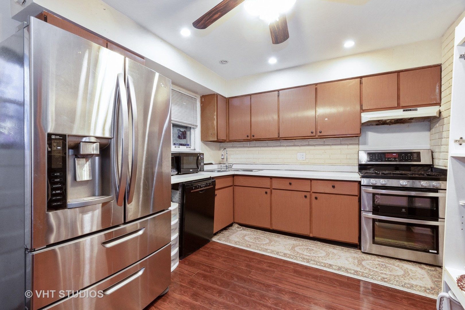 8826 Dee Road Des Plaines, IL 60016 - Photo 8 of 16 a kitchen with granite countertop stainless steel appliances and wooden cabinets