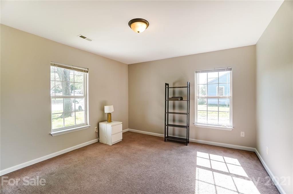 3003 Lowell Road Gastonia, NC 28054 - Photo 15 of 27 a view of an empty room with a window and bathroom