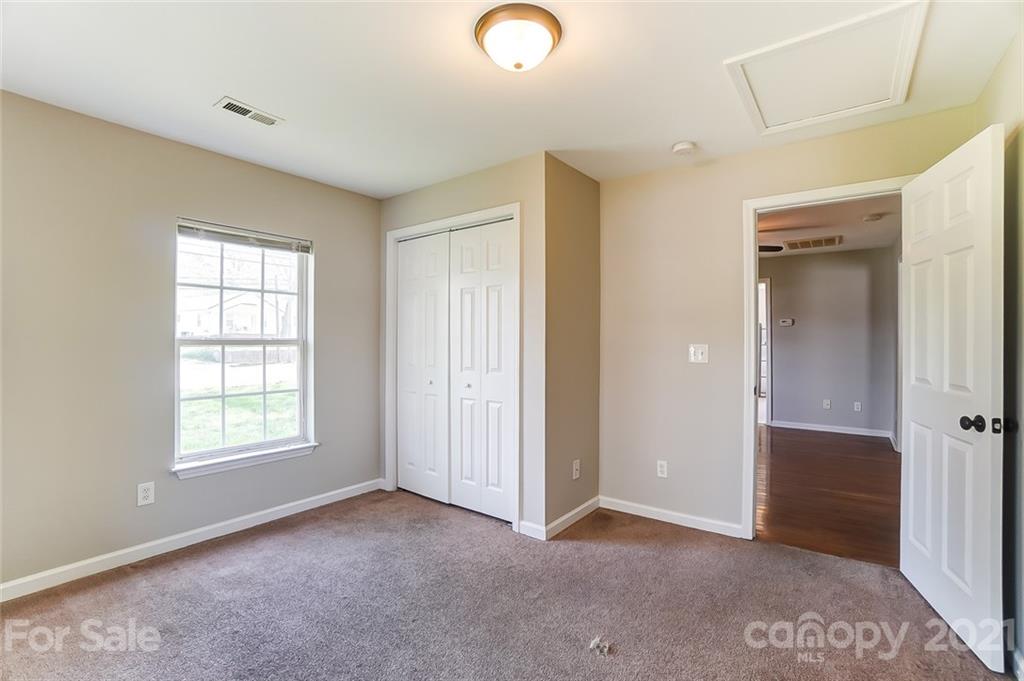 3003 Lowell Road Gastonia, NC 28054 - Photo 18 of 27 an empty room with windows and closet