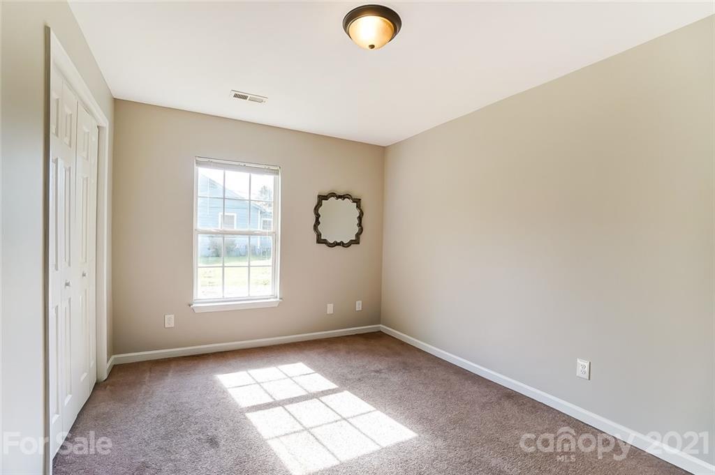 3003 Lowell Road Gastonia, NC 28054 - Photo 19 of 27 an empty room with windows