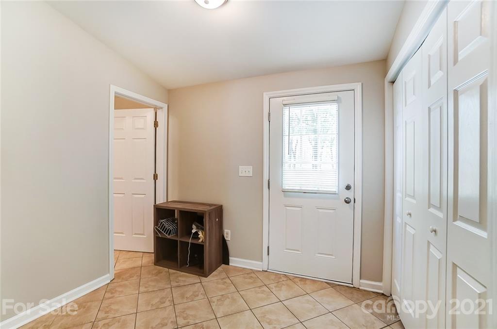 3003 Lowell Road Gastonia, NC 28054 - Photo 21 of 27 a view of a livingroom with a flesh screen tv